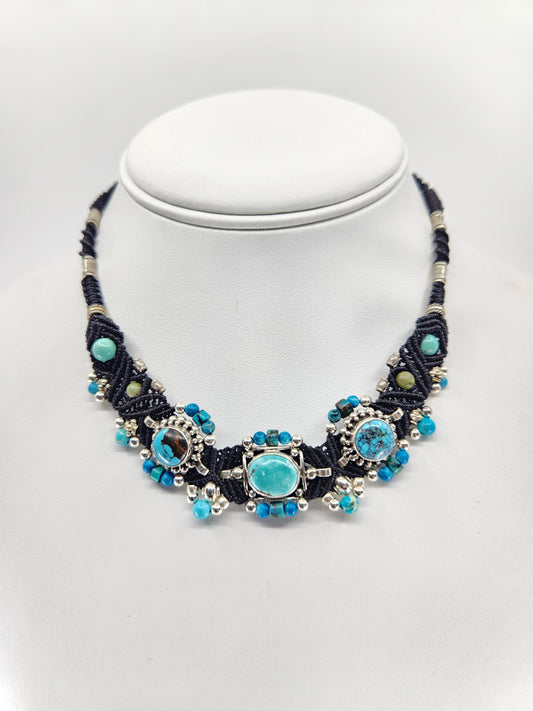 Isha Elafi - Handcrafted silver and turquoise stones  with black woven, knotwork