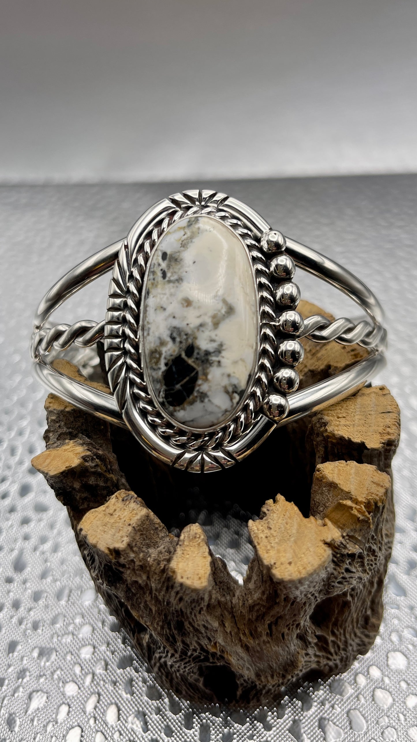 Desert Treasure: White Buffalo, black and white stone set in Sterling Silver Bracelet